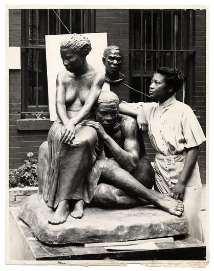 Augusta Savage with her sculpture Realization Andrew Herman, Photographic print, 1938 Source- Wikimedia Commons